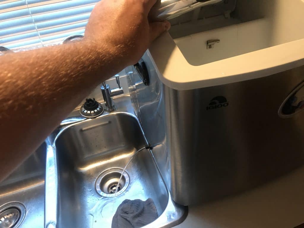 Drain the ice maker again while you are rinsing