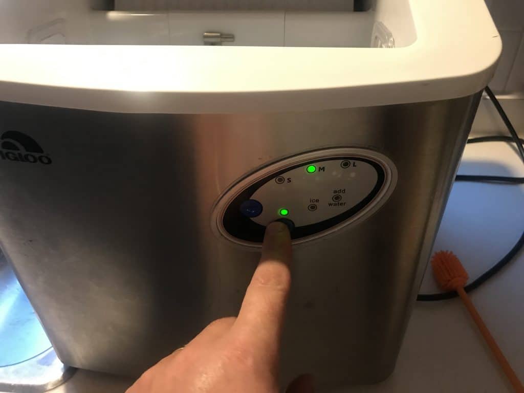 Start the ice cycle on a portable ice maker