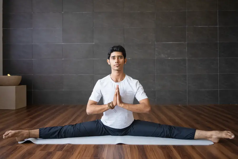 A Man Doing Splits To Improve Posture And Flexibility