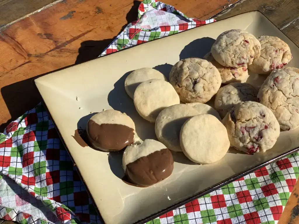 Assortment of cookies on a white plate.