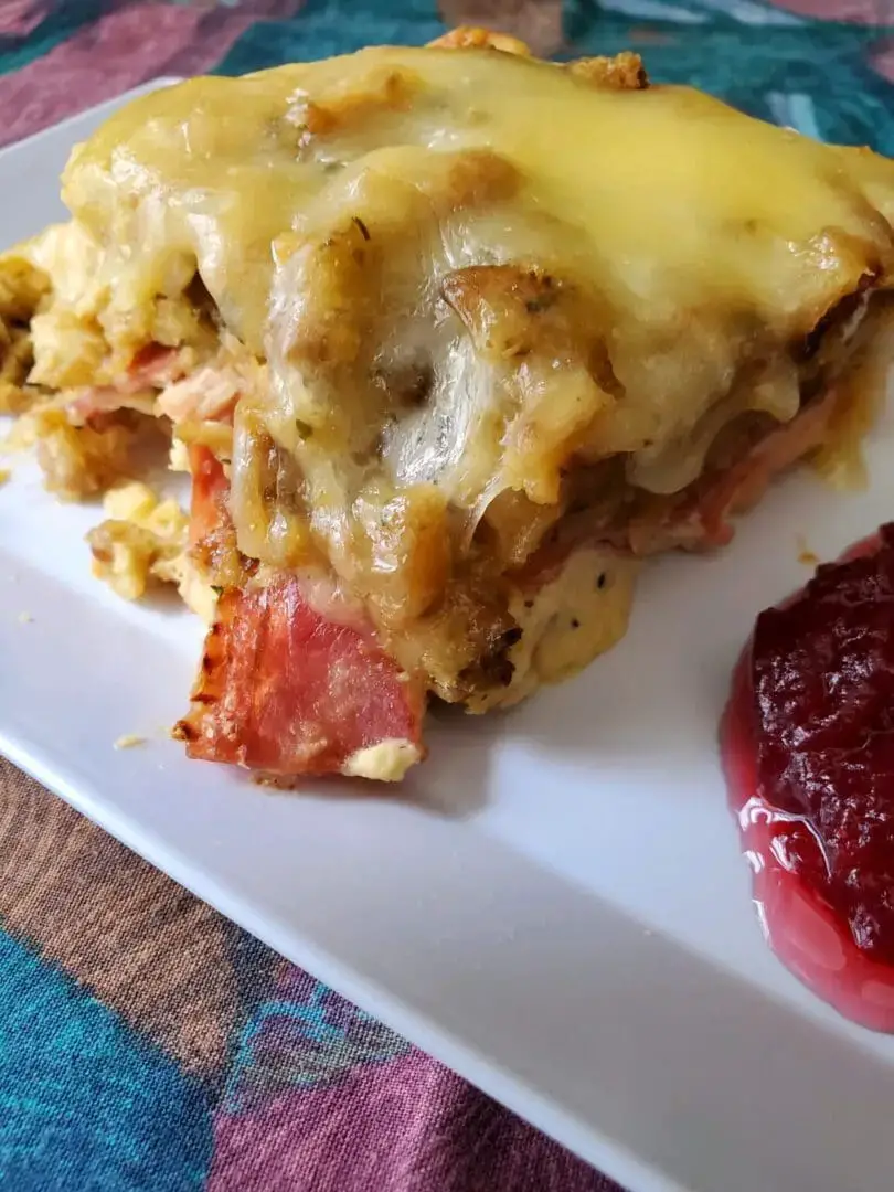 Crock Pot Chicken Cordon Bleu Cheesy baked dish with cranberry sauce.