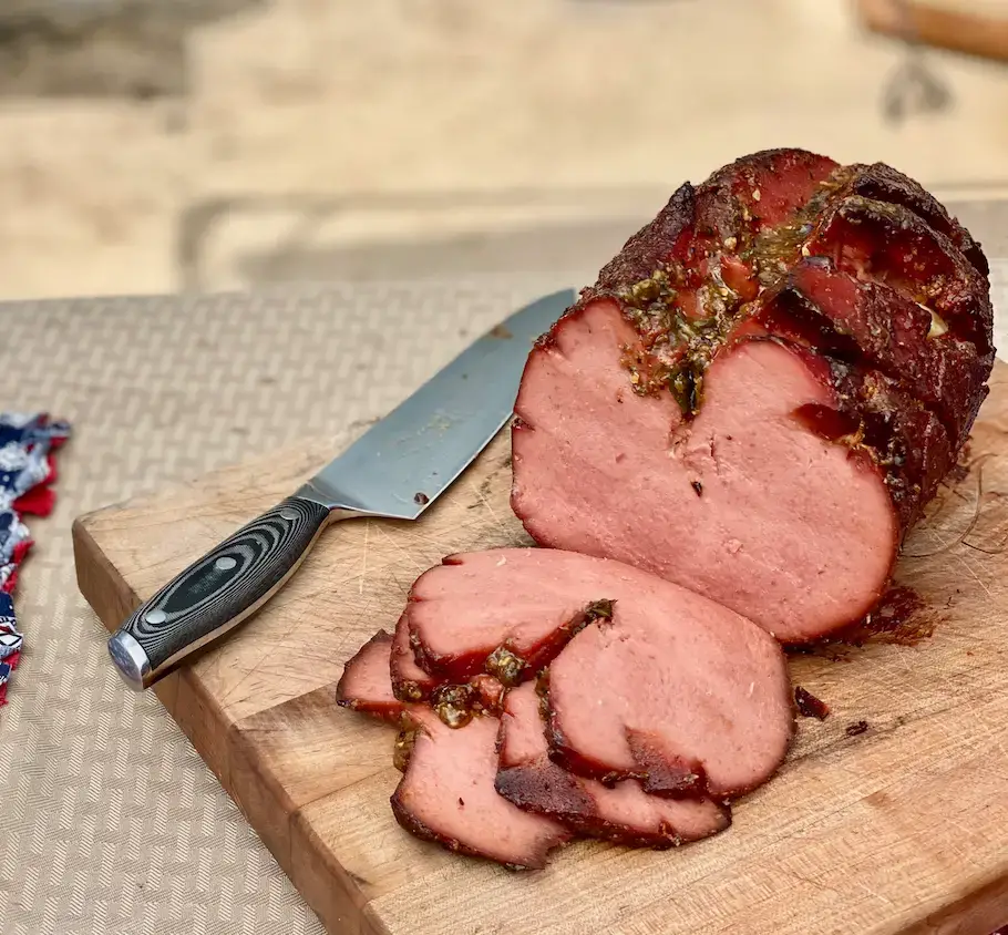 Best Smoked Bologna Smoked ham on a cutting board.