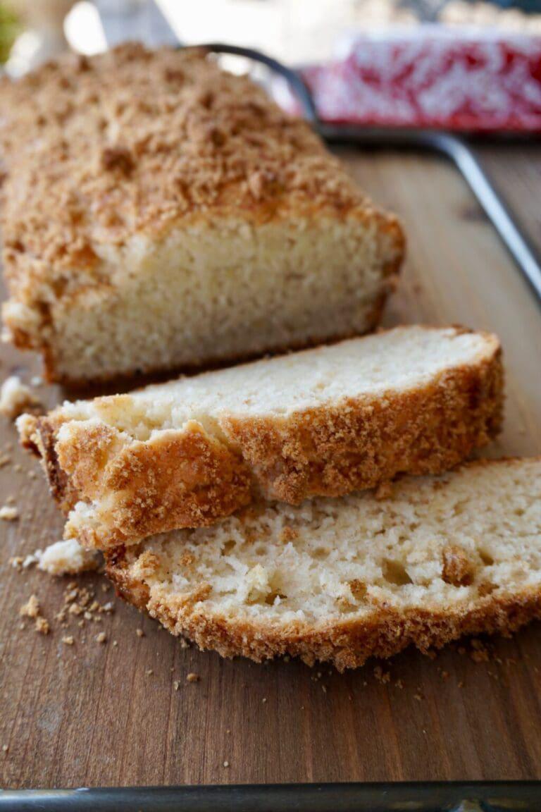 Slices of crumb-topped bread on a board.