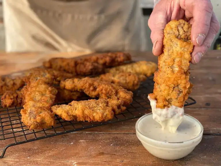 SteakFingersGravy-1-768x576 A person dipping some food into a bowl