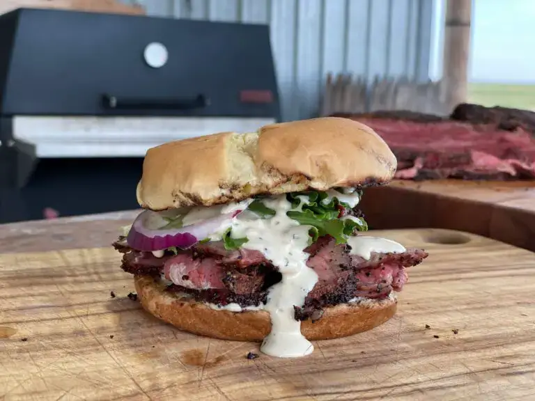 Tri-Tip-Featured-768x576 A sandwich with meat and sauce on top of it.