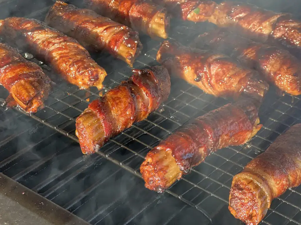 A grill with several different kinds of food on it.