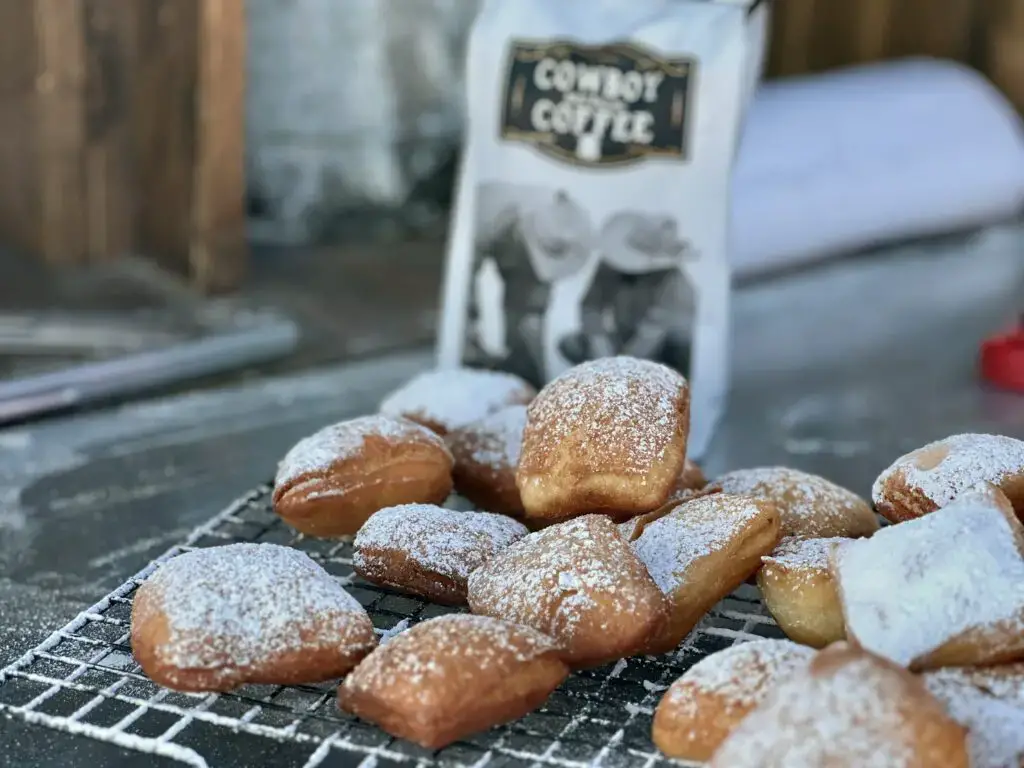 IMG_0764-2-1024x768 Powdered sugar beignets on wire rack.