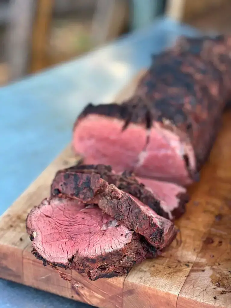 Beeftenderloinfeatured-768x1024 Grilled and sliced beef tenderloin on a cutting board.