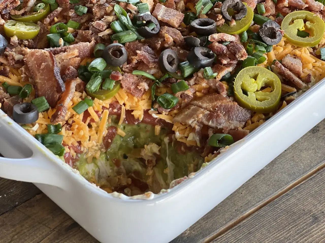 A casserole dish with meat, cheese and vegetables.