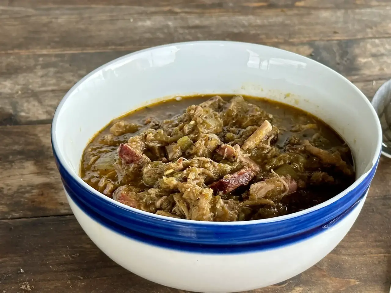 A bowl of stew with meat and vegetables.