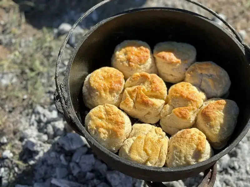 Freshly baked biscuits in a cast iron pot.