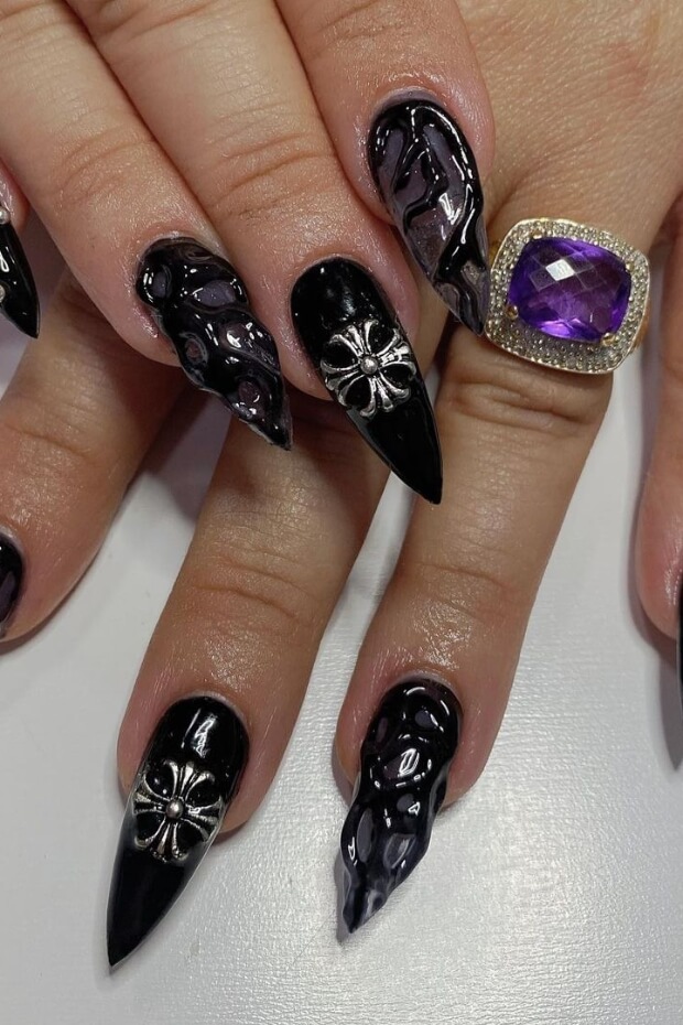 Premium Photo | A purple and black nail art design with purple flowers